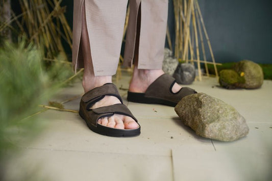 Brown leather adjustable sandals with Velcro straps by Omaking, featuring an antibacterial insole.