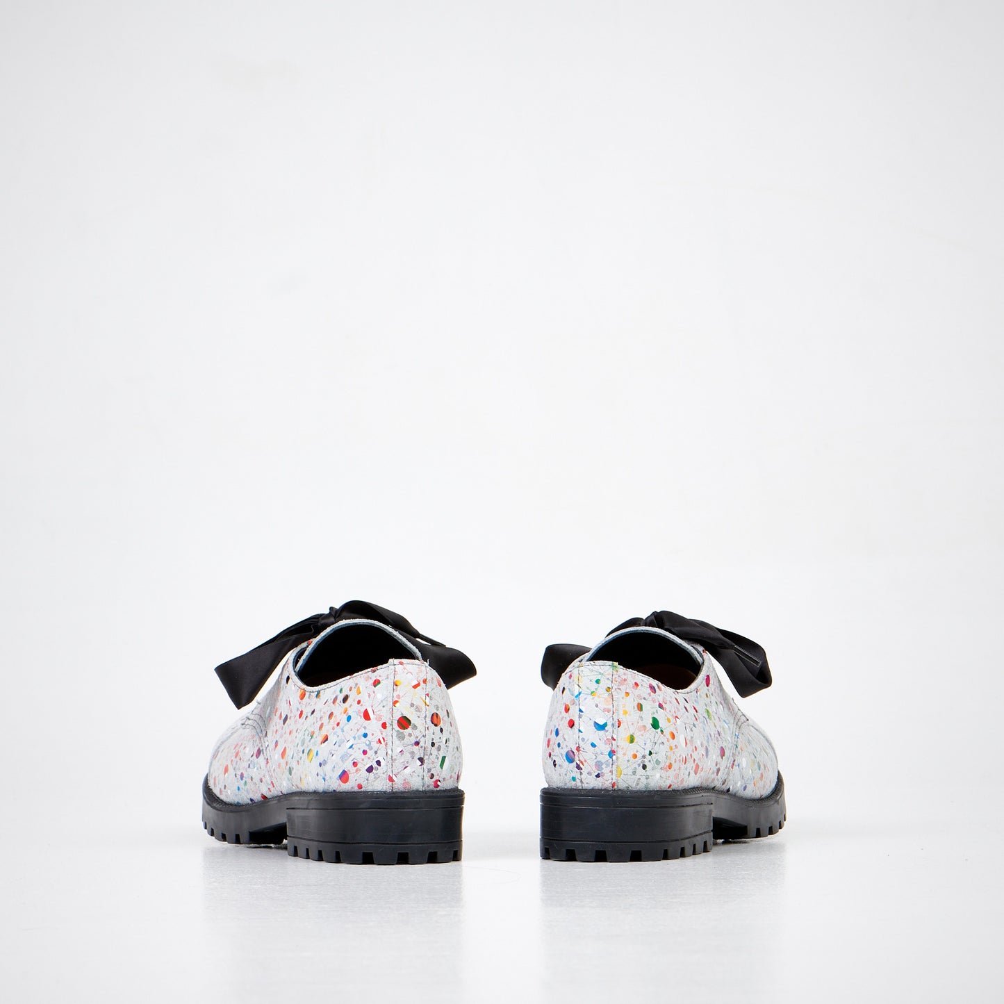 Colorful speckled leather unisex boots with a black bow, featuring an anatomical insole and durable sole by Samelin.