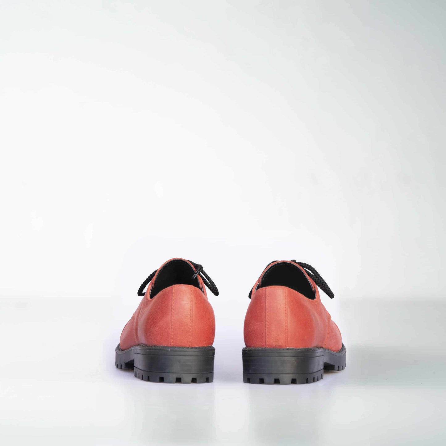 Red genuine leather military-grade boots with antibacterial features, unisex design by Samelin.