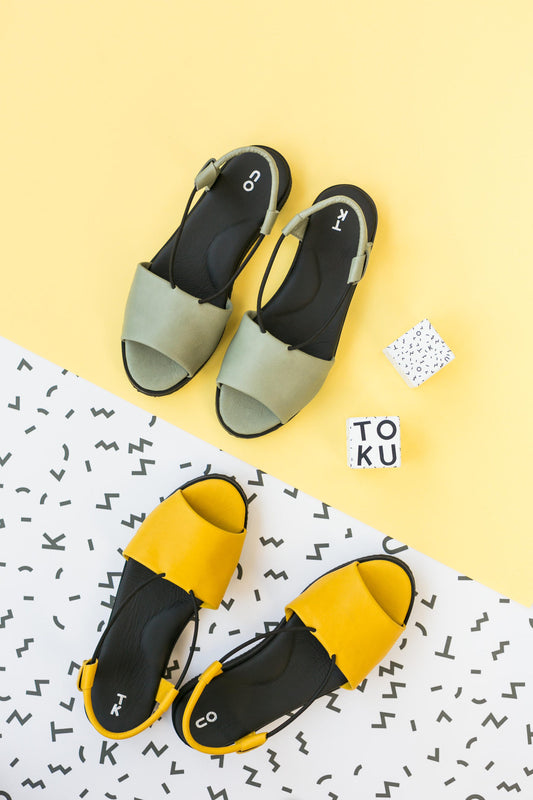 Green handmade leather sandals by TOKU with ergonomic design and EVA sole. Available in sizes 36, 37, and 38.