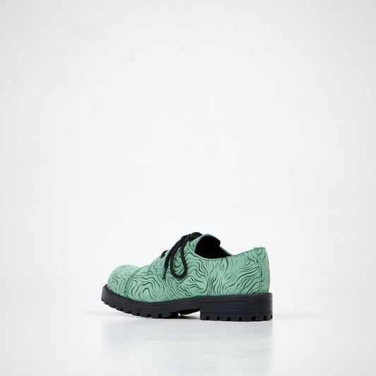 Green zebra-pattern leather boots with lace-up design and durable black PU sole by Samelin