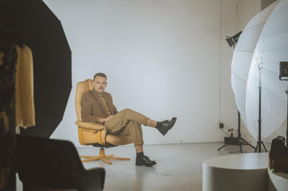 Black military grade leather boots by Samelin, featuring anatomical and antibacterial insoles, on a seated model.