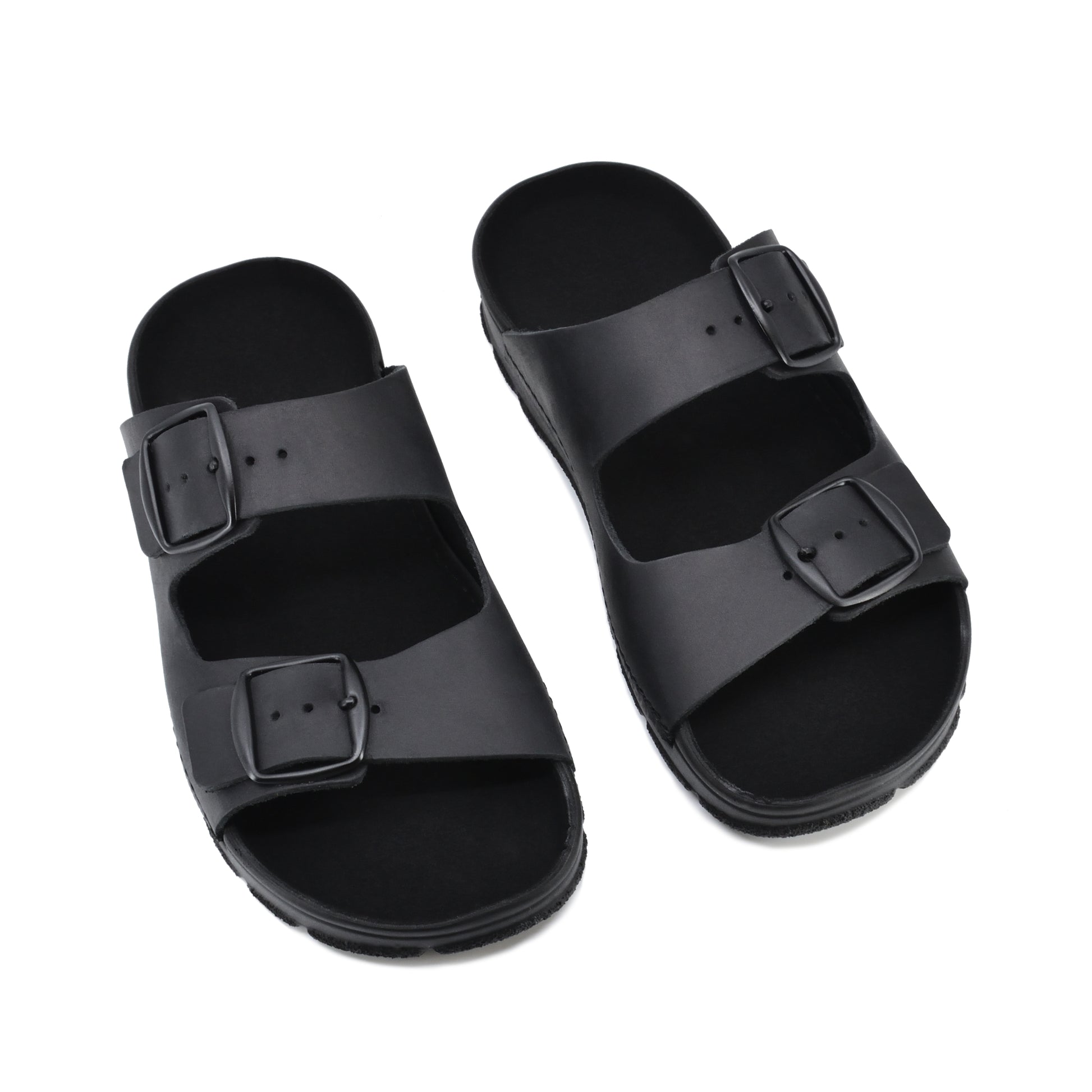 Black Meeliku sandals by Omaking with two adjustable buckle straps. Available in sizes 36, 37, and 38.