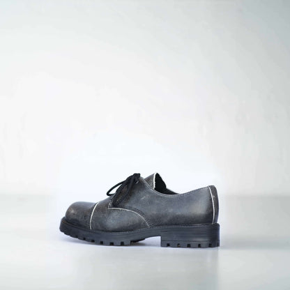 Antique military-grade leather boots by Samelin with anatomical footbed and direct-injected PU sole in black.