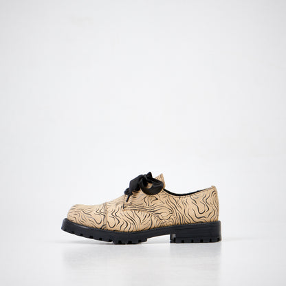 Beige zebra print lace-up shoes with black sole, available in sizes 36, 37, and 38 by Samelin.