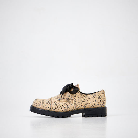 Beige zebra print lace-up shoes with black sole, available in sizes 36, 37, and 38 by Samelin.