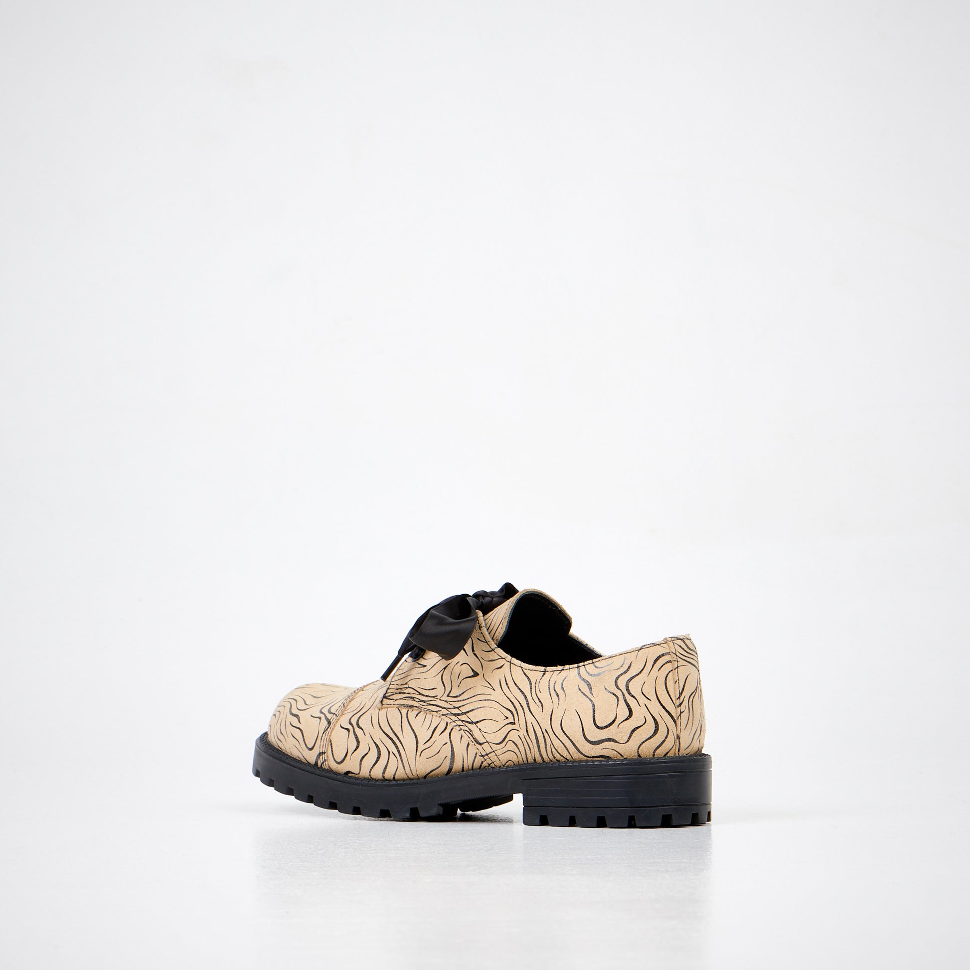 Beige zebra print shoes with black laces by Samelin, available in sizes 36, 37, and 38.