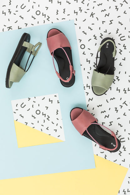 Green handmade leather sandals from TOKU with ergonomic design and EVA sole, featuring adjustable straps.