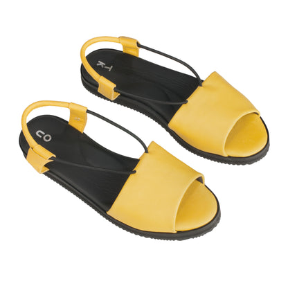 Yellow handmade leather sandals by TOKU with an ergonomic design and EVA sole