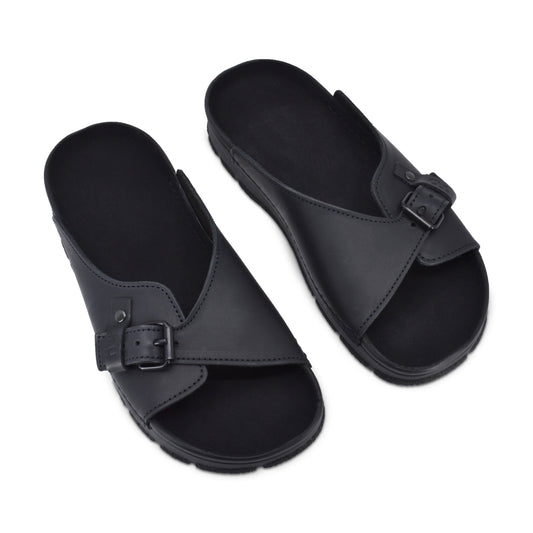 Black TOKU Rome sandals by Omaking with a crossover strap and adjustable buckle. Available in sizes 36, 37, and 38.