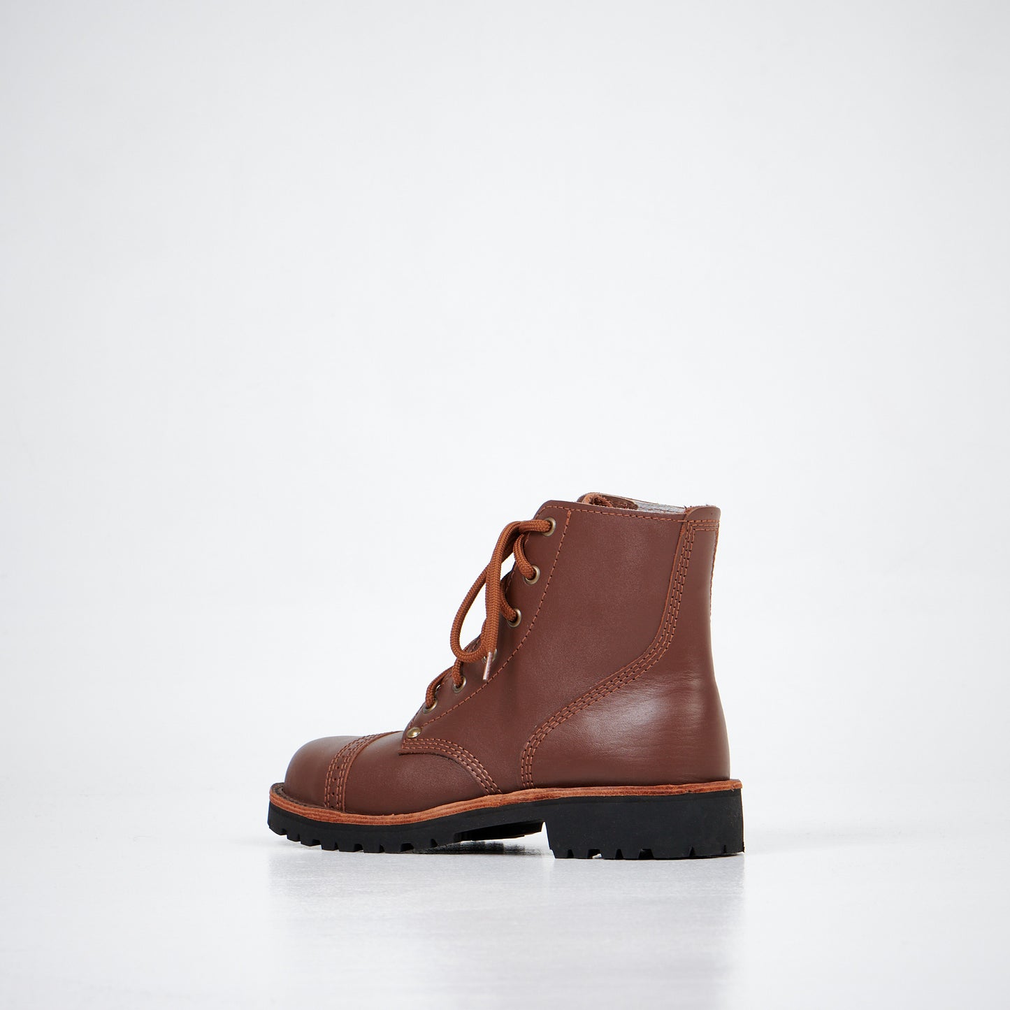 Brown leather ankle boots with lace-up front and textured sole from AIPI. Available in multiple sizes.
