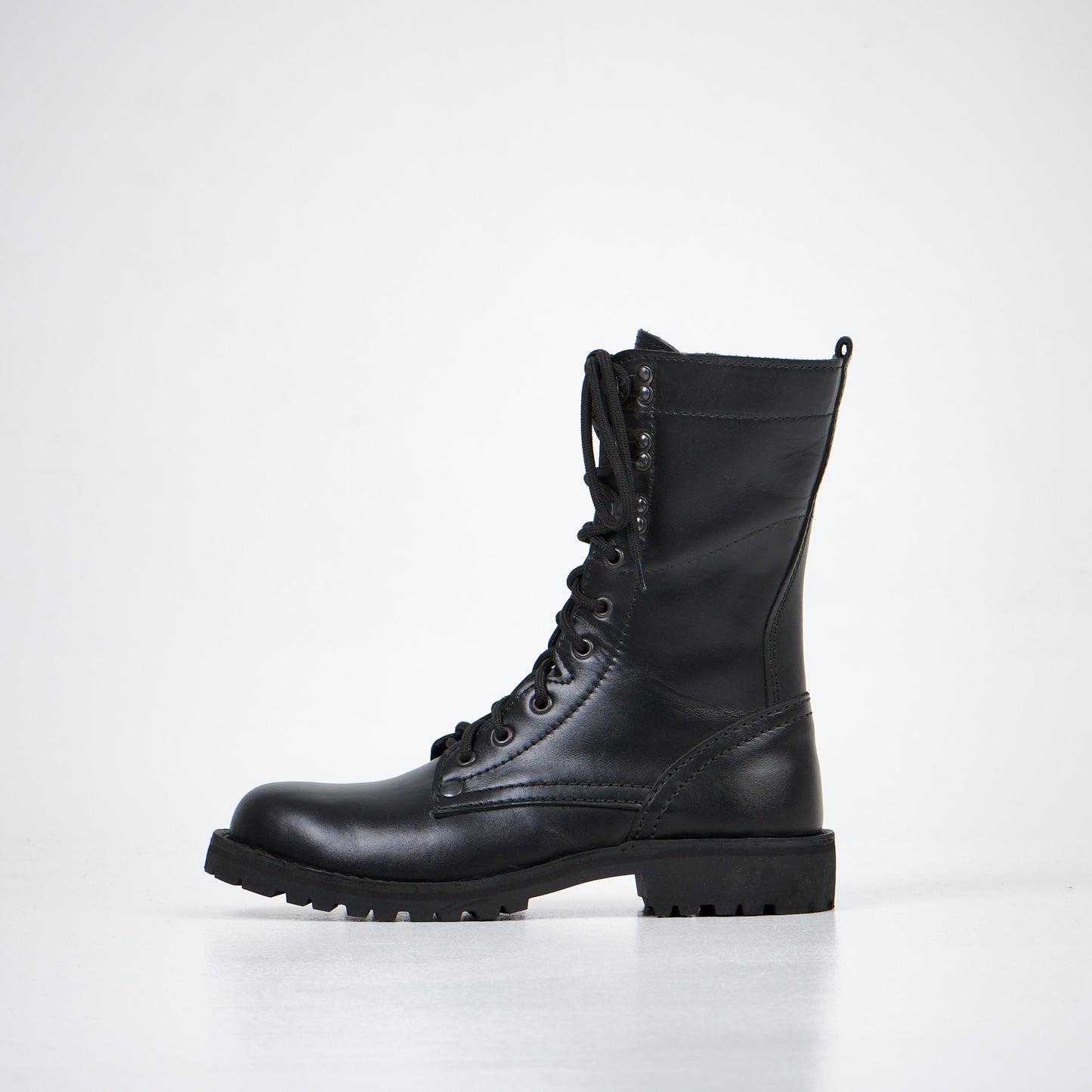 Black leather combat boots with lace-up front and rugged sole, AIPI-2 model by aipi.