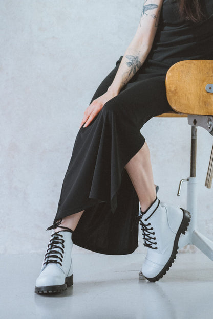 White water-repellent leather aviator ankle boots with black laces by Samelin.