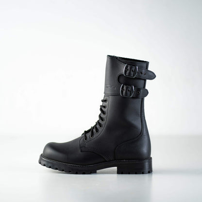 Black water-repellent leather military boots with adjustable buckles, by Samelin.