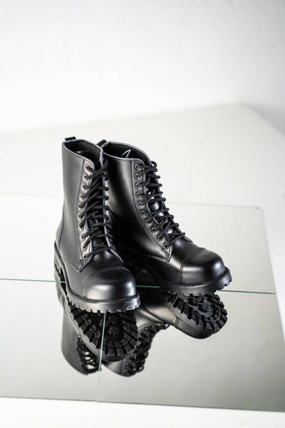 Black leather combat boots with lace-up front and rugged sole, unisex NATO standard by Samelin.