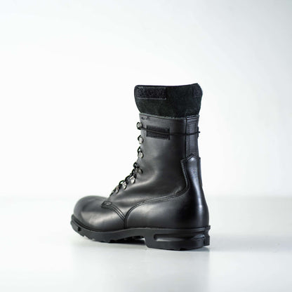 Black full-grain leather combat boots with lace-up design and anatomical insole by Samelin.