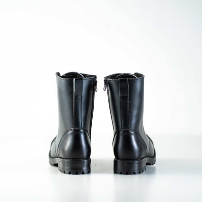 Black leather combat boots with fur lining, zip closure, and anatomical insole by Samelin.