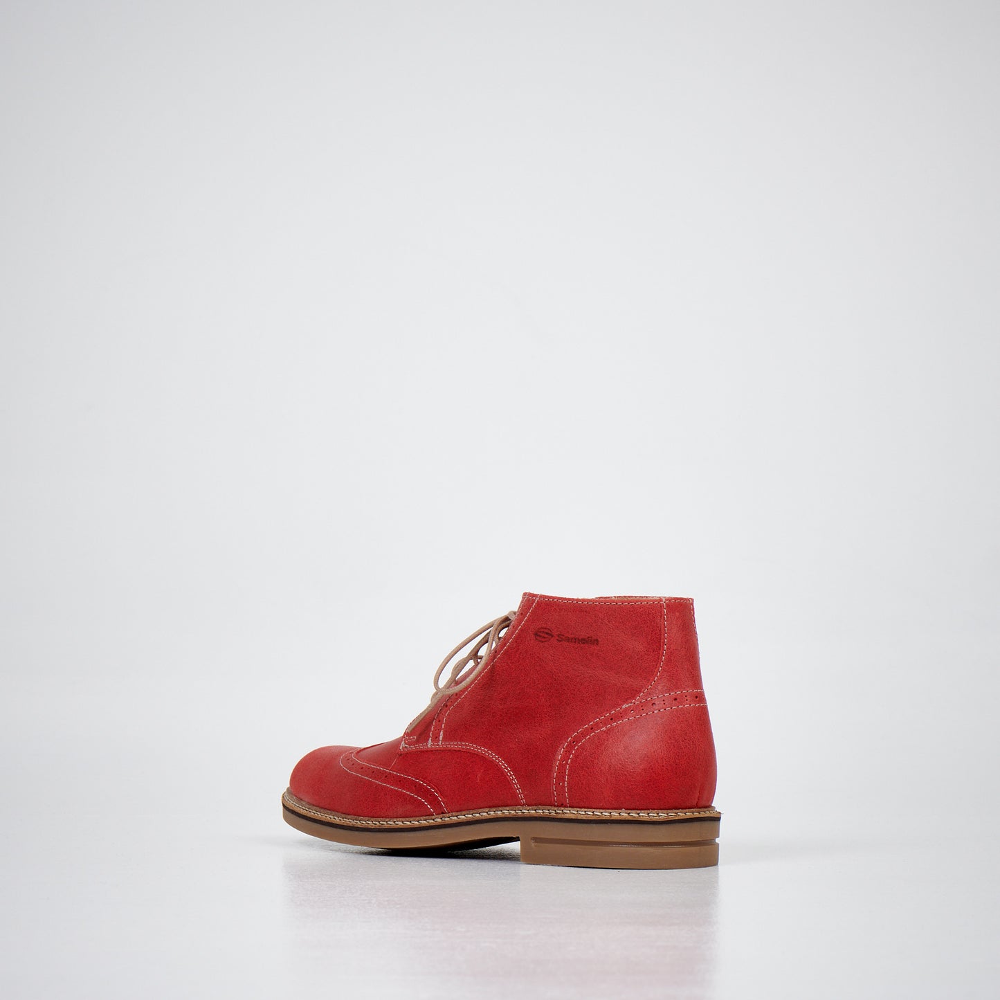 Red suede ankle boots from Samelin with lace-up design and tan sole, available in sizes 39, 40, and 41.
